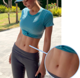woman showing her strong tight stomach muscle